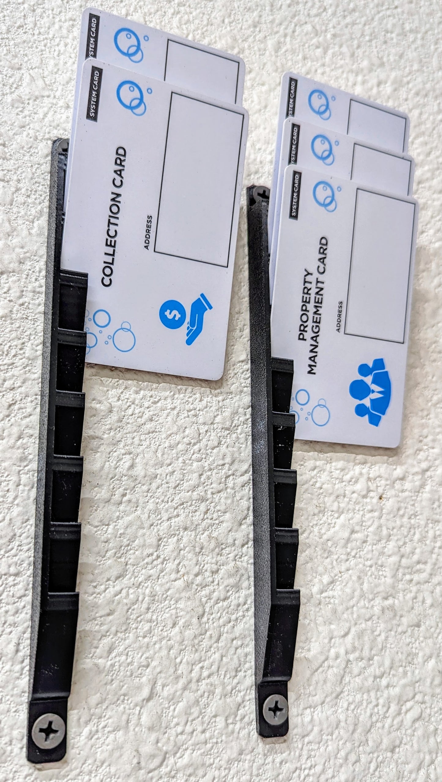 Wall-mounted card holder 2-pack close-up with business cards